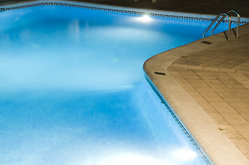 Image showing hotel large swimming pool with night lights