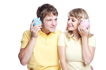 Image showing Young couple saving money