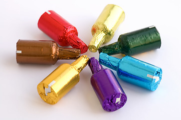 Image showing Colorful chocolate bottles