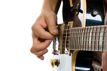 Image showing How to hold guitar pick