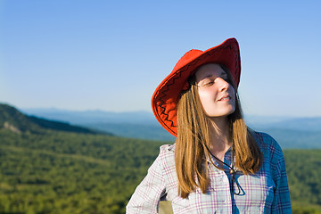 Image showing Young woman in cowboy looking hat