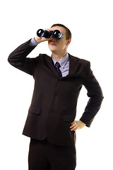 Image showing Man in formal suit look into binoculars