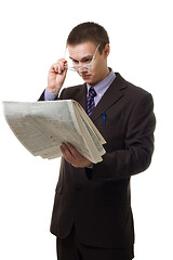 Image showing Young hansome man in suit with newspaper