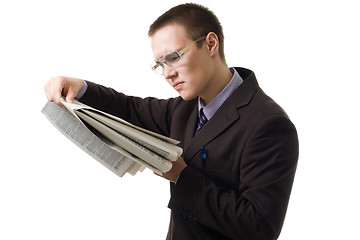 Image showing Young hansome man in suit read newspaper