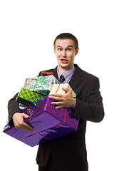 Image showing Young crazy man with many presents 