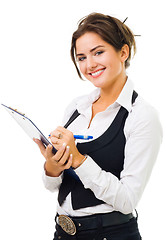 Image showing Happy woman with big smile write on tablet