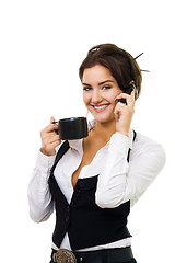 Image showing Young woman drink and speak by cell phone