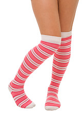 Image showing woman legs in color pink socks isolated 