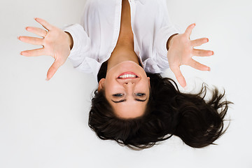 Image showing Woman smile and stretch out hands - top view