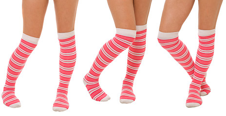 Image showing Pairs of women legs in pink socks