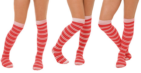 Image showing Pairs of women legs in red socks