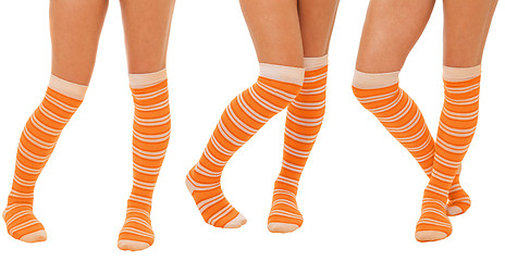 Image showing Pairs of women legs in orange socks