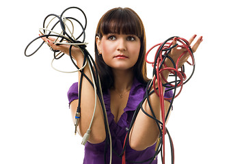 Image showing Young woman hold wires and have problem