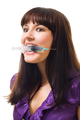 Image showing Crazy looking woman with syringe 