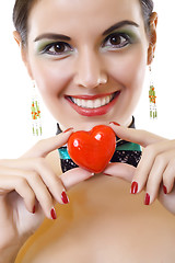 Image showing young pretty girl holding heart