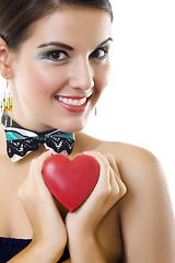 Image showing beautiful woman holding a love symbol in hands