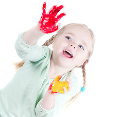 Image showing Little girl playing with colors