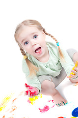 Image showing Little girl playing with colors