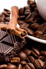 Image showing chocolate, coffee beans, cinnamon sticks and cup
