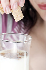 Image showing Young people eating milk with cereals