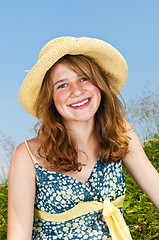 Image showing Portrait of young girl smiling in meadow