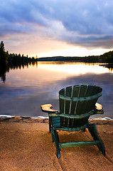 Image showing Wooden chair at sunset on beach