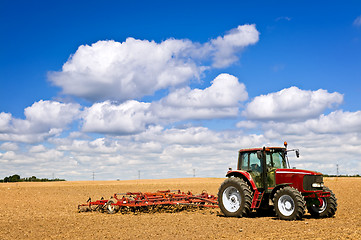 Image showing Tractor in plowed field