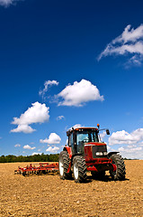 Image showing Tractor in plowed field