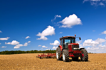 Image showing Tractor in plowed field