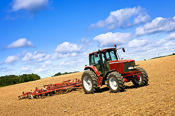 Image showing Tractor in plowed field