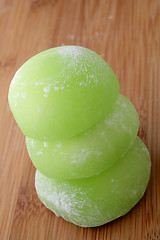 Image showing Stack of green dango