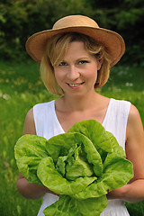 Image showing Young woman holding fresh lettuce