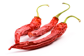 Image showing three dry red chilly peppers