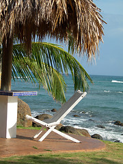 Image showing chair under thatched roof hut corn island nicaragua