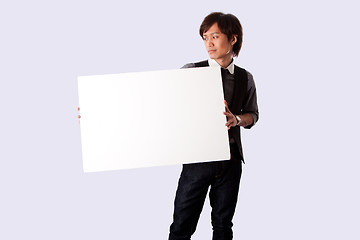 Image showing Young business man with white board