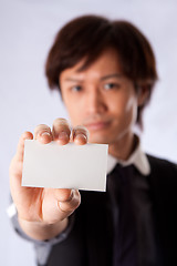 Image showing Asian business man with white card