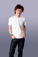 Image showing Smiling Asian man in white shirt