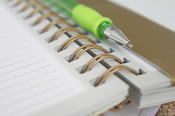 Image showing A pen and a notebook