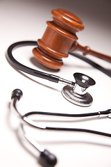 Image showing Gavel and Stethoscope on Gradated Background