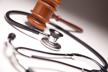 Image showing Gavel and Stethoscope on Gradated Background