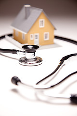 Image showing Stethoscope and Model House on Gradated Background