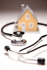 Image showing Stethoscope and Model House on Gradated Background