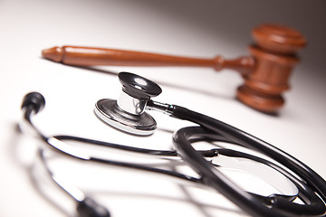 Image showing Gavel and Stethoscope on Gradated Background