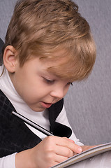 Image showing Boy writing