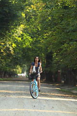 Image showing Woman riding a bicycle