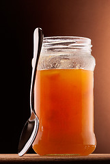 Image showing apricot jam and tea spoon
