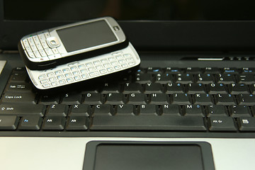 Image showing Smartphone on notebook