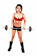 Image showing Young girl lifting weight.