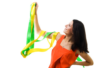 Image showing Woman in orange dress with flying ribbon