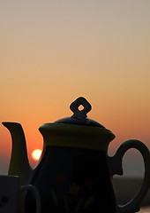 Image showing Sunset And Tea Set